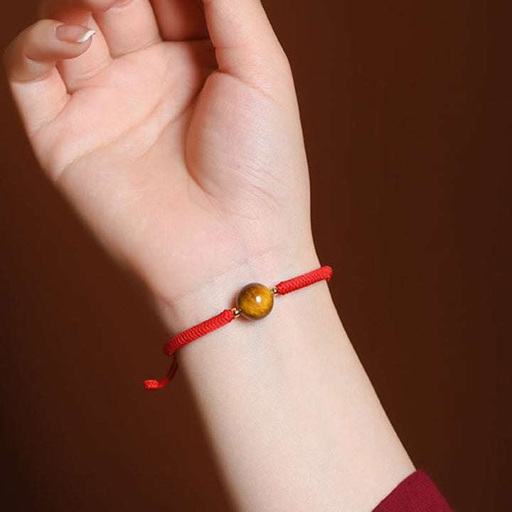 Bracelet en corde de protection porte-bonheur en perles d'œil de tigre faites à la main avec des Buddha Stones