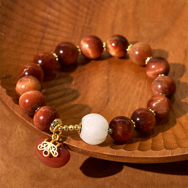 Bracelet calme en œil de tigre rouge naturel de Buddha Stones