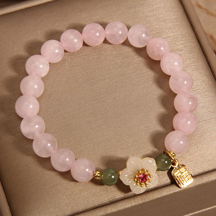 Bracelet de guérison des relations de caractère Fu en jade Hetian en quartz rose et fleur de pêcher en Buddha Stones