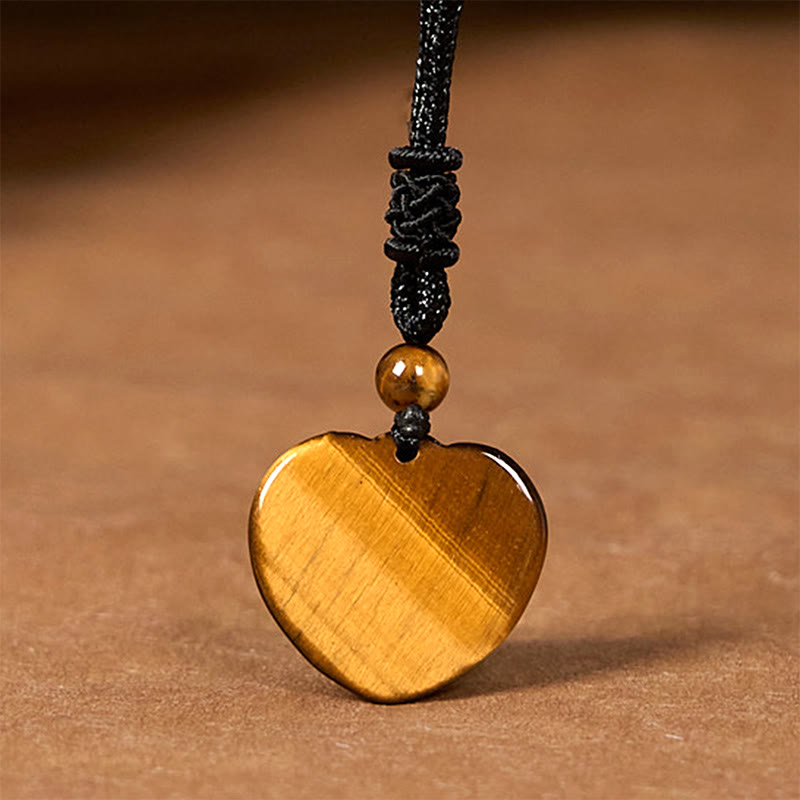 Collier pendentif en corde de protection avec motif cœur et œil de tigre naturel en Buddha Stones