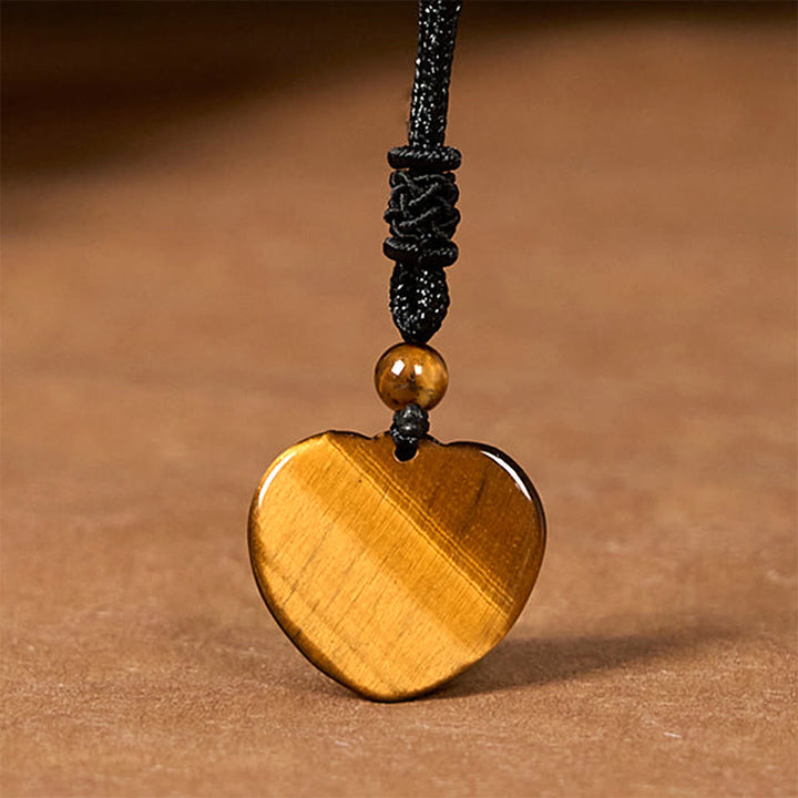 Collier pendentif en corde de protection avec motif cœur et œil de tigre naturel en Buddha Stones