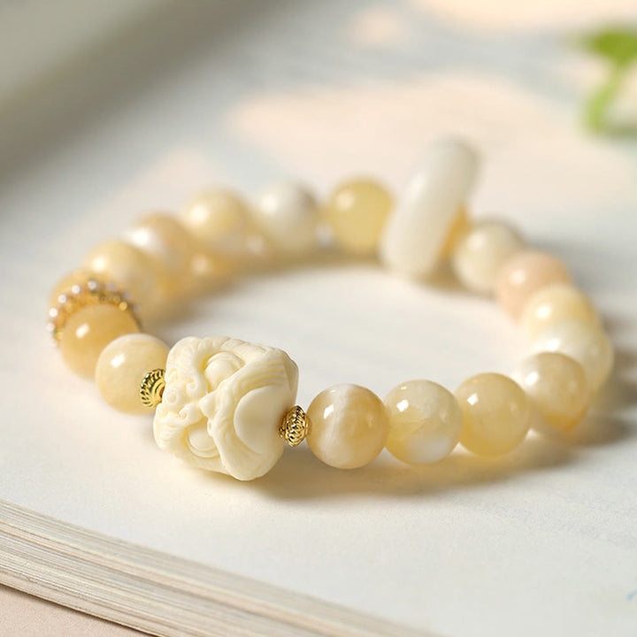 Bracelet de confiance en Buddha Stones, ambre, agate grise, ivoire et fruit
