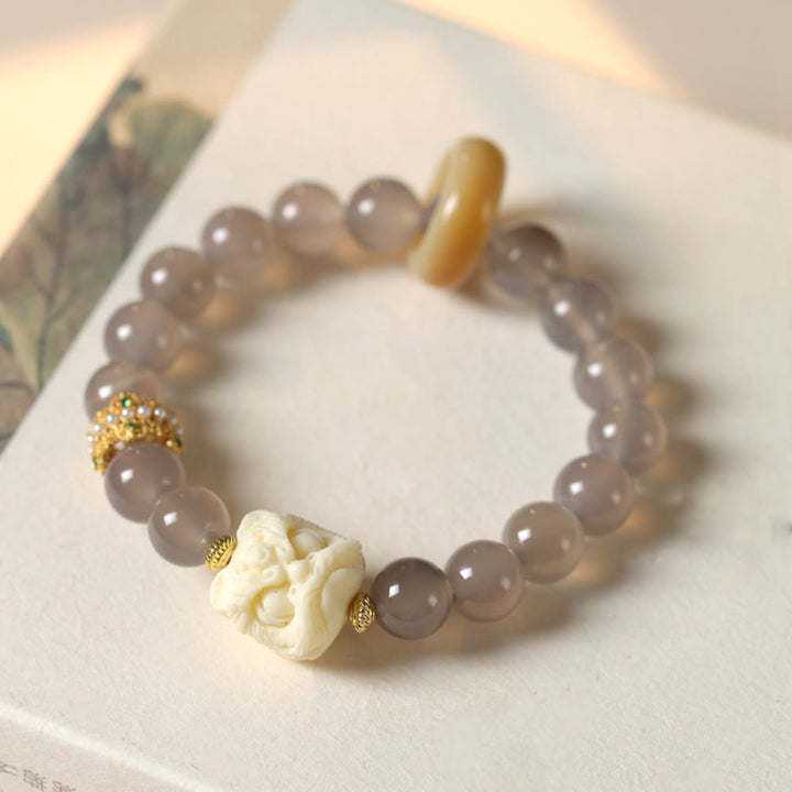 Bracelet de confiance en Buddha Stones, ambre, agate grise, ivoire et fruit