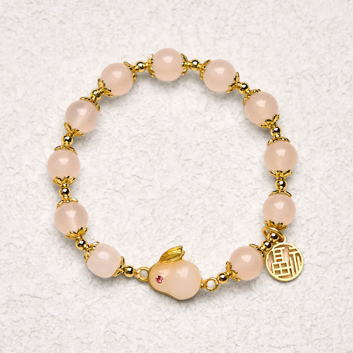 Bracelet de confiance en Buddha Stones rouge et calcédoine avec le personnage Fu du lapin