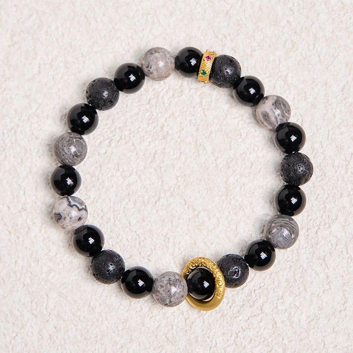 Bracelet de guérison en Buddha Stones de lave, onyx noir, jaspe Picasso