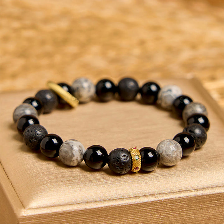 Bracelet de guérison en Buddha Stones de lave, onyx noir, jaspe Picasso