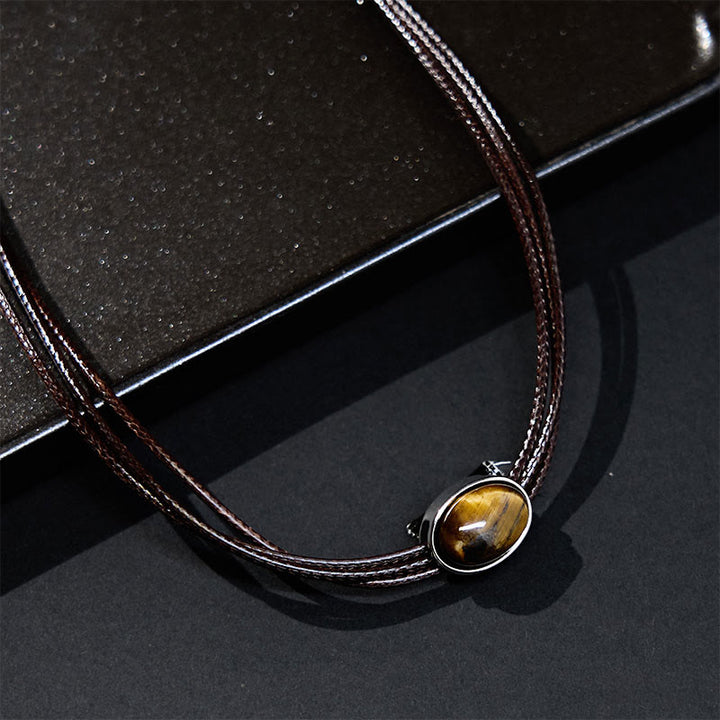 Collier avec pendentif en corde de cire et ellipse en œil de tigre naturel et Buddha Stones