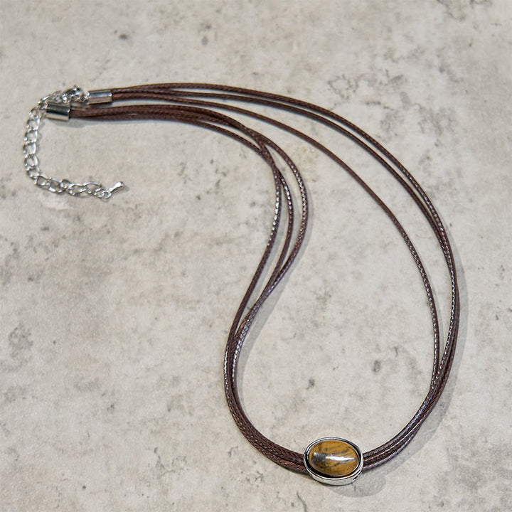 Collier avec pendentif en corde de cire et ellipse en œil de tigre naturel et Buddha Stones