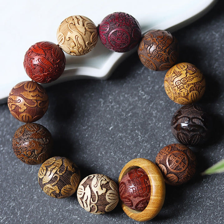 Bracelet de guérison en bois de santal sculpté avec Buddha Stones et symbole du zodiaque chinois, dragon, phénix, caractère Fu