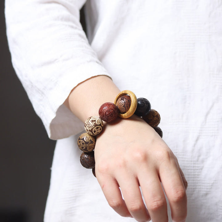 Bracelet de guérison en bois de santal sculpté avec Buddha Stones et symbole du zodiaque chinois, dragon, phénix, caractère Fu
