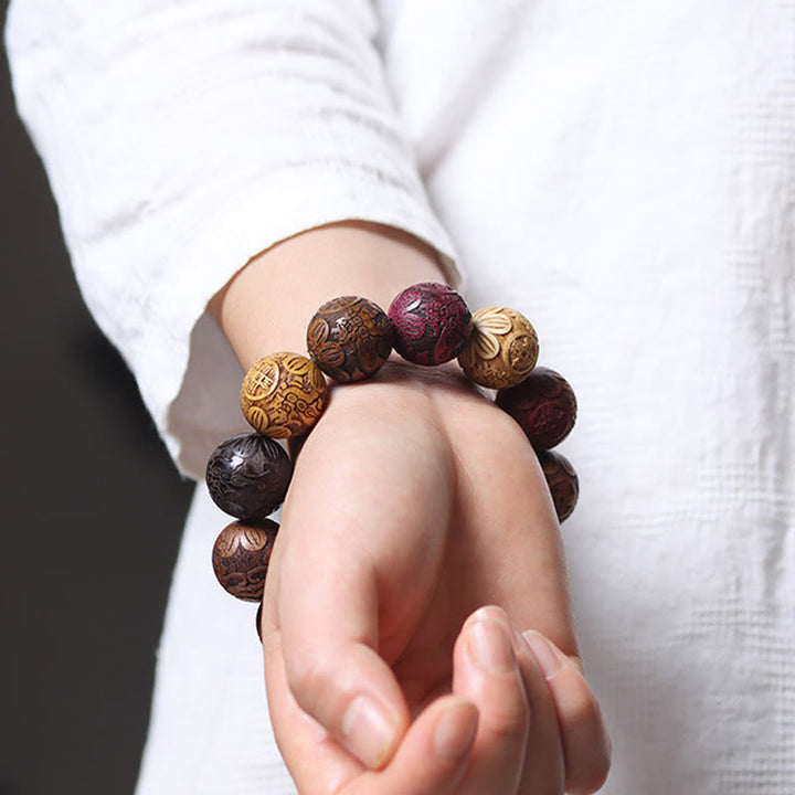 Bracelet de guérison en bois de santal sculpté avec Buddha Stones et symbole du zodiaque chinois, dragon, phénix, caractère Fu