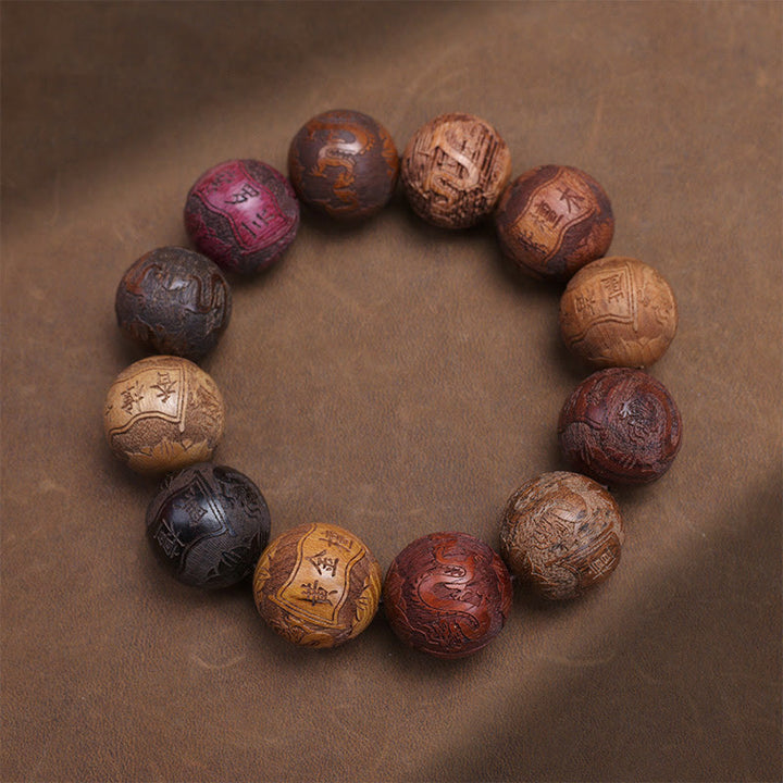 Bracelet de guérison en bois de santal sculpté avec Buddha Stones et symbole du zodiaque chinois, dragon, phénix, caractère Fu