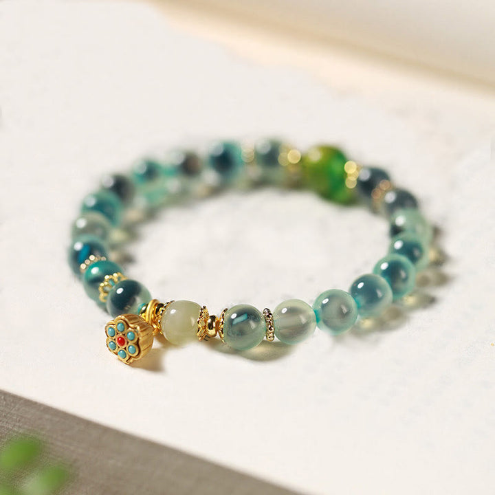 Bracelet de guérison en agate bonbon colorée naturelle et Buddha Stones , gousse de lotus dorée - Agate bonbon bleue (tour de poignet : 14-15 cm) - image 1