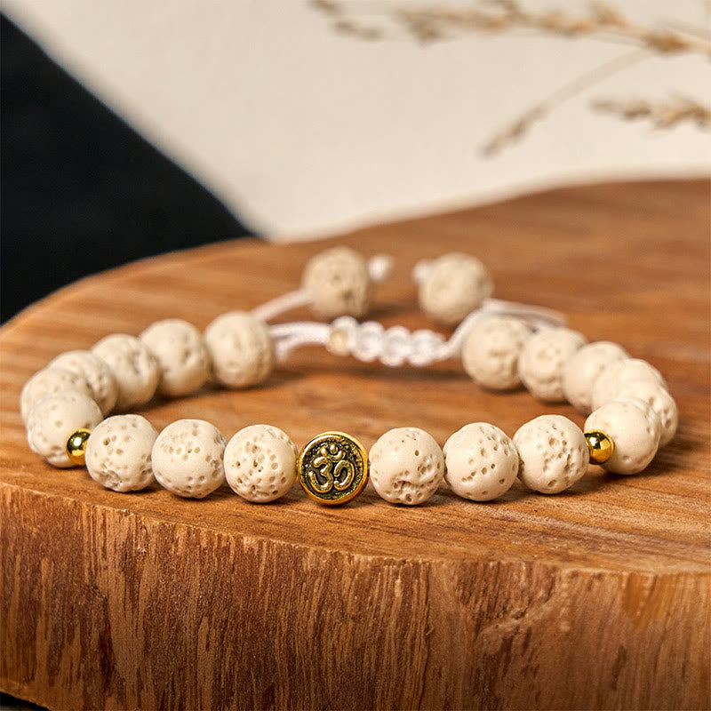 Bracelet de guérison et de calme en Buddha Stones de lave blanches avec symbole Om - image 2