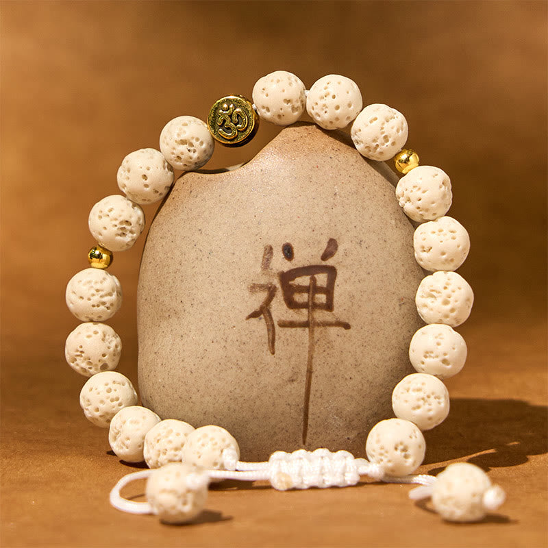 Bracelet de guérison et de calme en Buddha Stones de lave blanches avec symbole Om - image 1
