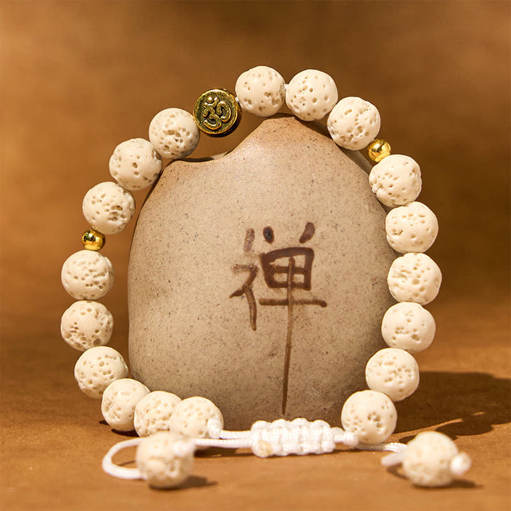 Bracelet de guérison et de calme en Buddha Stones de lave blanches avec symbole Om - image 1