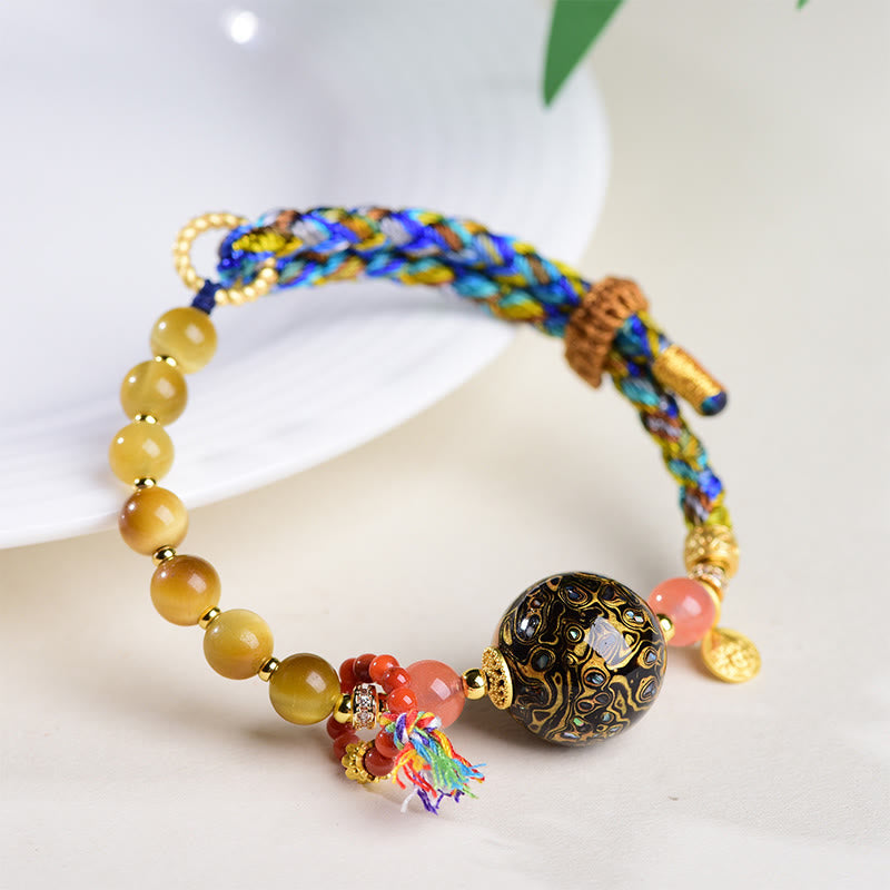 Bracelet de protection en pierre œil de tigre tissé à la main avec perles de laque tibétaine et Buddha Stones - image 3