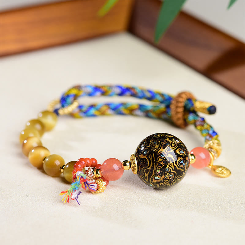 Bracelet de protection en pierre œil de tigre tissé à la main avec perles de laque tibétaine et Buddha Stones - image 1
