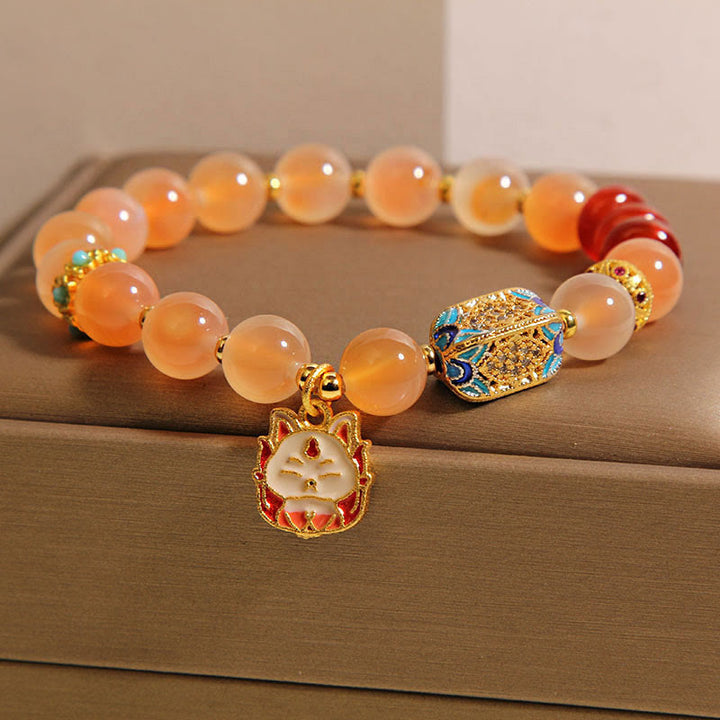 Bracelet de guérison en agate orange bonbon naturelle à neuf queues de Buddha Stones - image 2