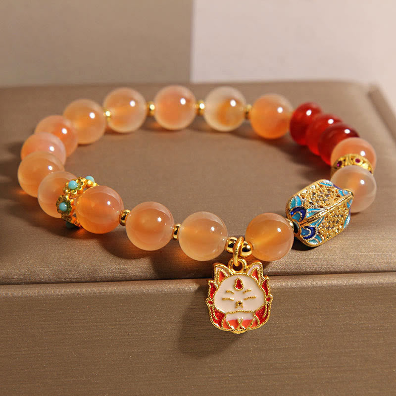 Bracelet de guérison en agate orange bonbon naturelle à neuf queues de Buddha Stones - image 1