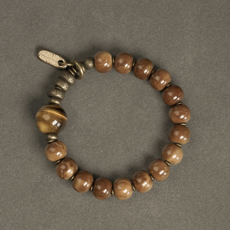 Bracelet porte-bonheur en cuivre et obsidienne dorée avec Buddha Stones de Kuka et œil de tigre