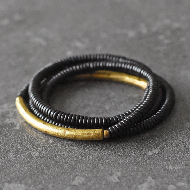 Bracelet multicouches en bois d'ébène et cuivre avec Buddha Stones