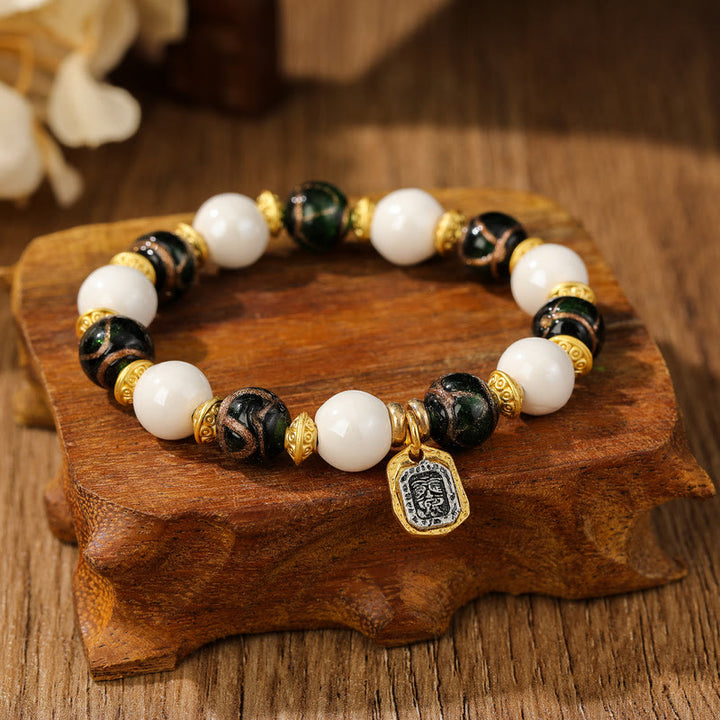 Bracelet de protection en perles de porcelaine en cendres et en verre Liuli avec breloque en Buddha Stones et déesse de la richesse tibétaine Zakiram
