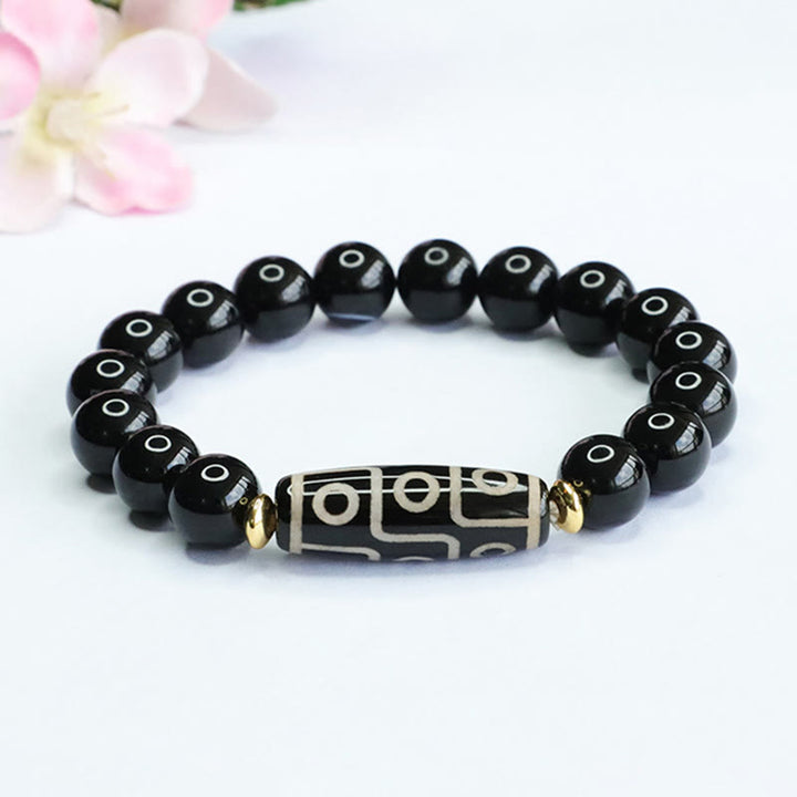 Bracelet de puissance tibétain en onyx noir avec perles dzi à neuf yeux et Buddha Stones
