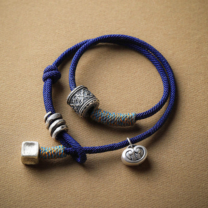 Bracelet en corde double enroulé en Buddha Stones fait à la main avec amulette de bon augure sculptée Om Mani Padme Hum