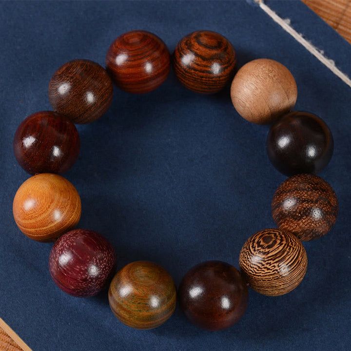 Bracelet de guérison et de protection en bois de santal multicolore Buddha Stones
