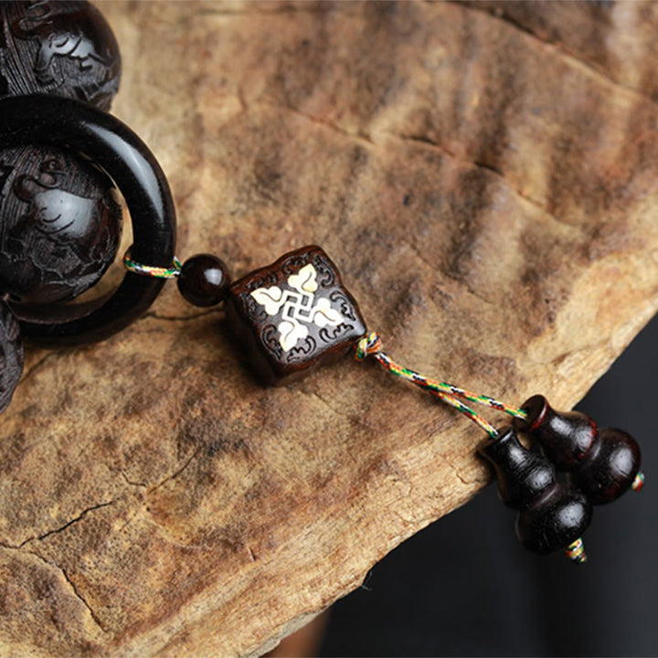 Bracelet d'équilibre en bois d'ébène avec Buddha Stones et caractères chinois Yin Yang gravés