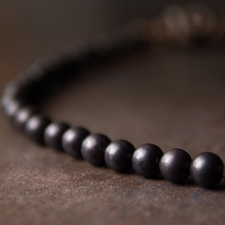 Bracelet de couple en cuivre avec perles en bois d'ébène et Buddha Stones