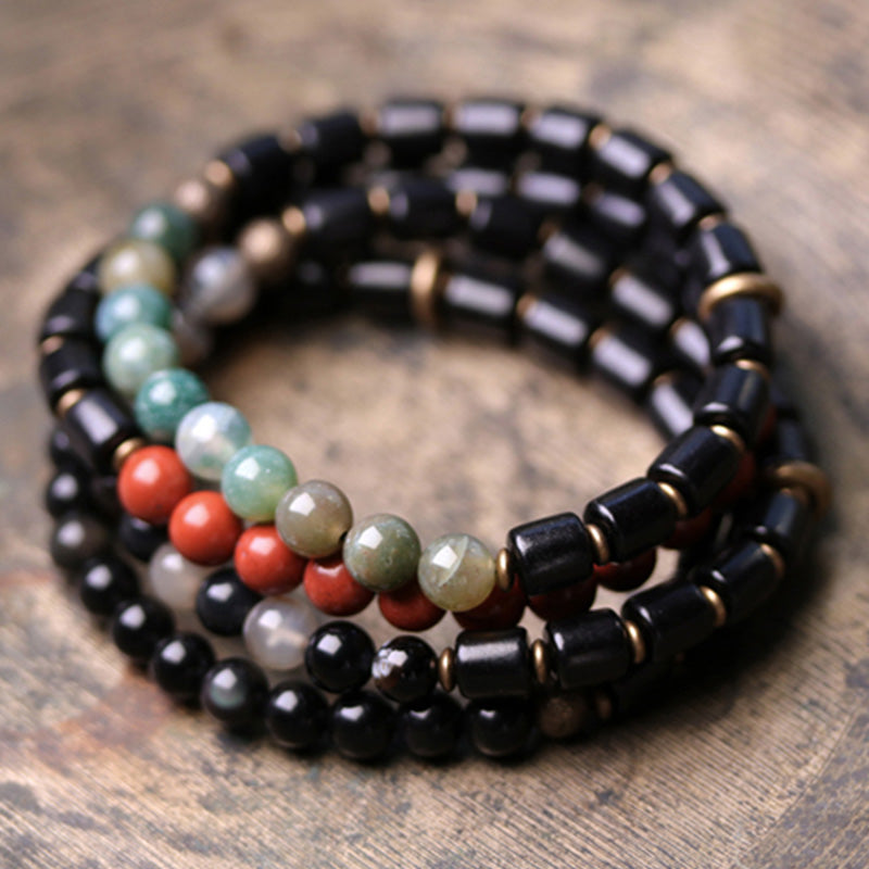 Bracelet couple paix Buddha Stones bois d'ébène jaspe rouge mousse agate cristal cuivre