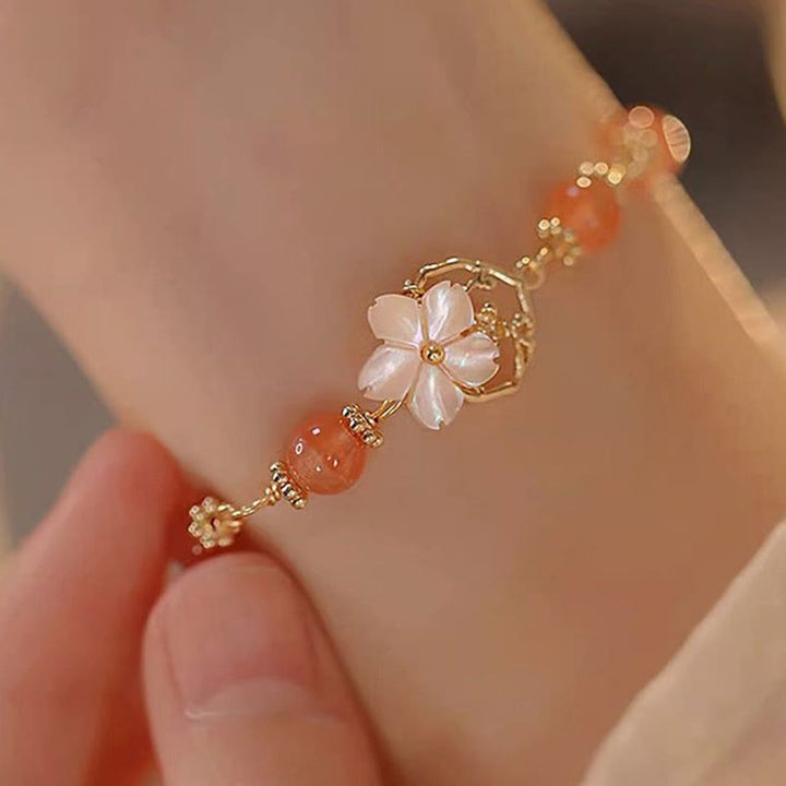 Bracelet de confiance en forme de fleur en pierre d'agate rouge Tridacna de Buddha Stones