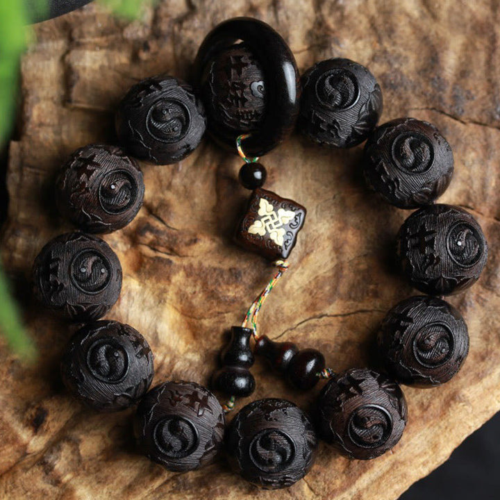 Bracelet d'équilibre en bois d'ébène avec Buddha Stones et caractères chinois Yin Yang gravés