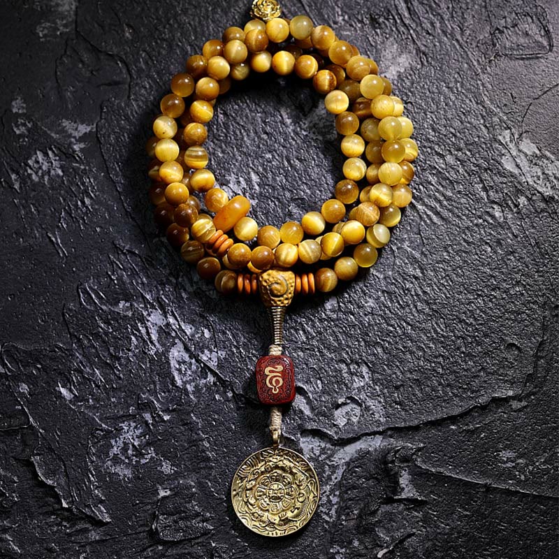 Bracelet à pompon de protection Dorje en cuivre avec 108 Buddha Stones Mala en œil de tigre naturel