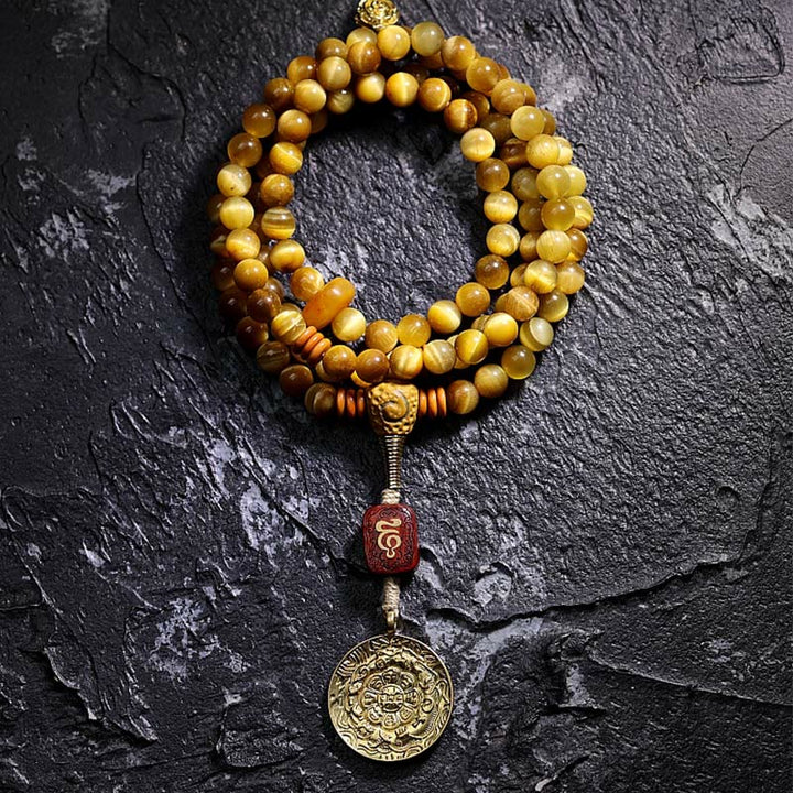 Bracelet à pompon de protection Dorje en cuivre avec 108 Buddha Stones Mala en œil de tigre naturel