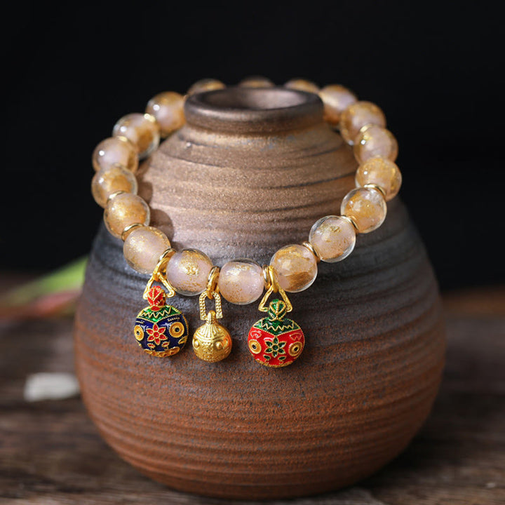 Bracelet de bénédictions en perles de verre Liuli avec breloque en or et argent et feuille d'or représentant la famille des bêtes Buddha Stones