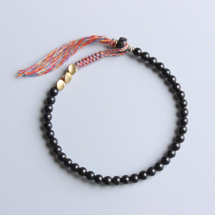 Bracelet à pampilles en onyx noir tibétain fait main avec Buddha Stones