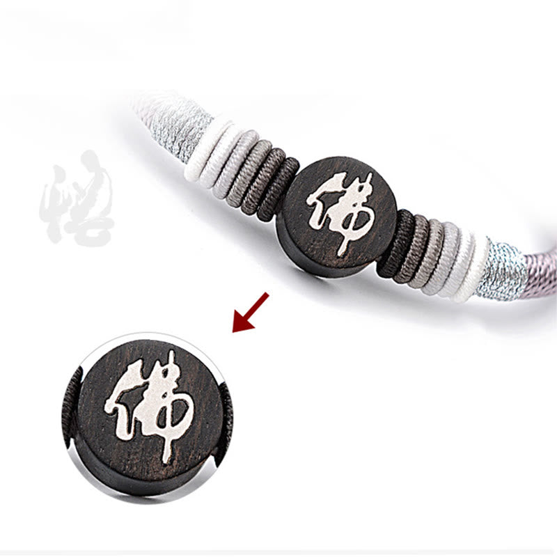 Bracelet en corde fait main en ébène avec personnage de Bouddha de Buddha Stones