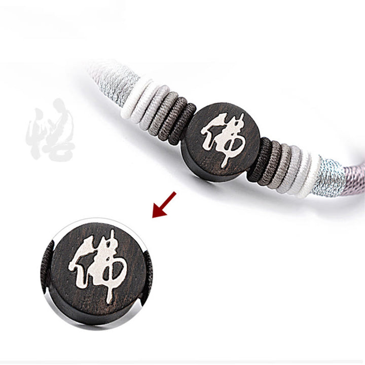 Bracelet en corde fait main en ébène avec personnage de Bouddha de Buddha Stones