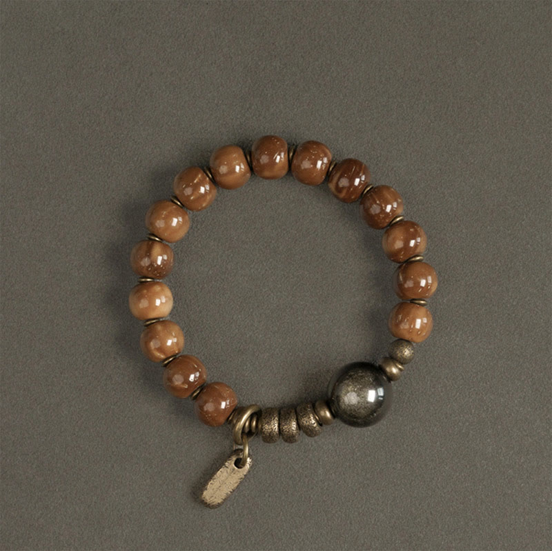 Bracelet porte-bonheur en cuivre et obsidienne dorée avec Buddha Stones de Kuka et œil de tigre