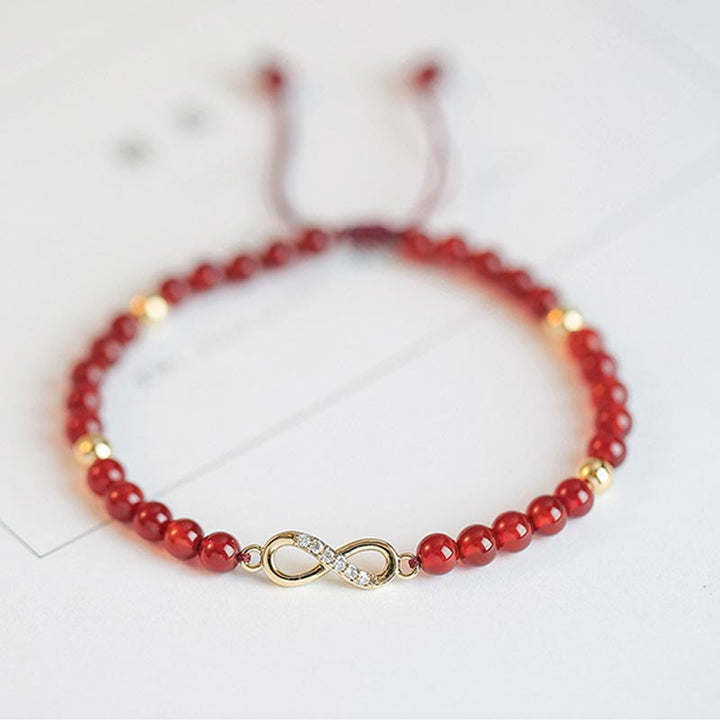 Bracelet de confiance en forme d'étoile à quatre feuilles en agate rouge naturelle avec nœud sans fin