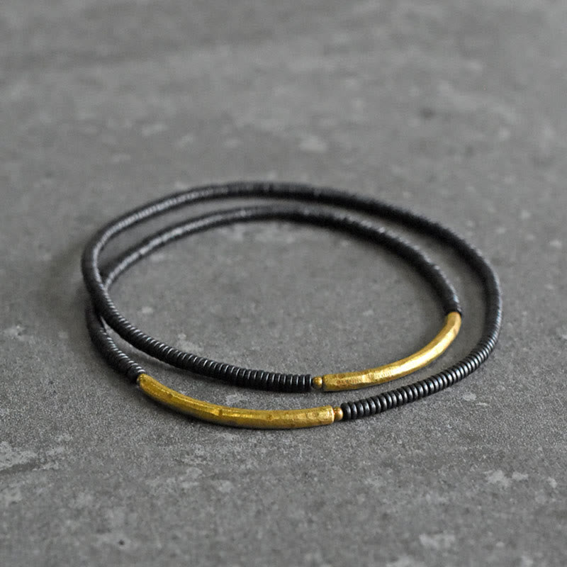 Bracelet multicouches en bois d'ébène et cuivre avec Buddha Stones