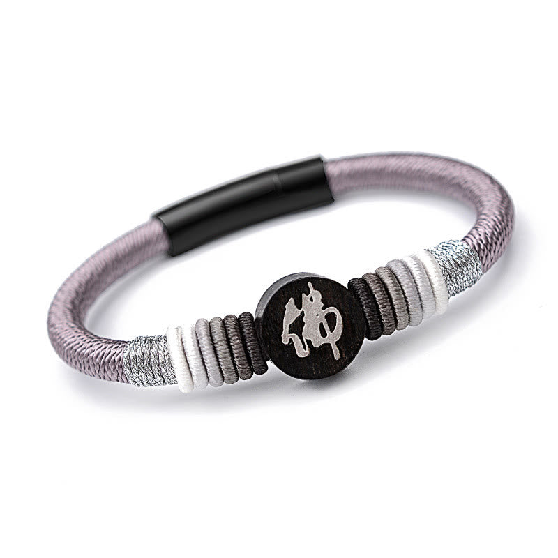 Bracelet en corde fait main en ébène avec personnage de Bouddha de Buddha Stones