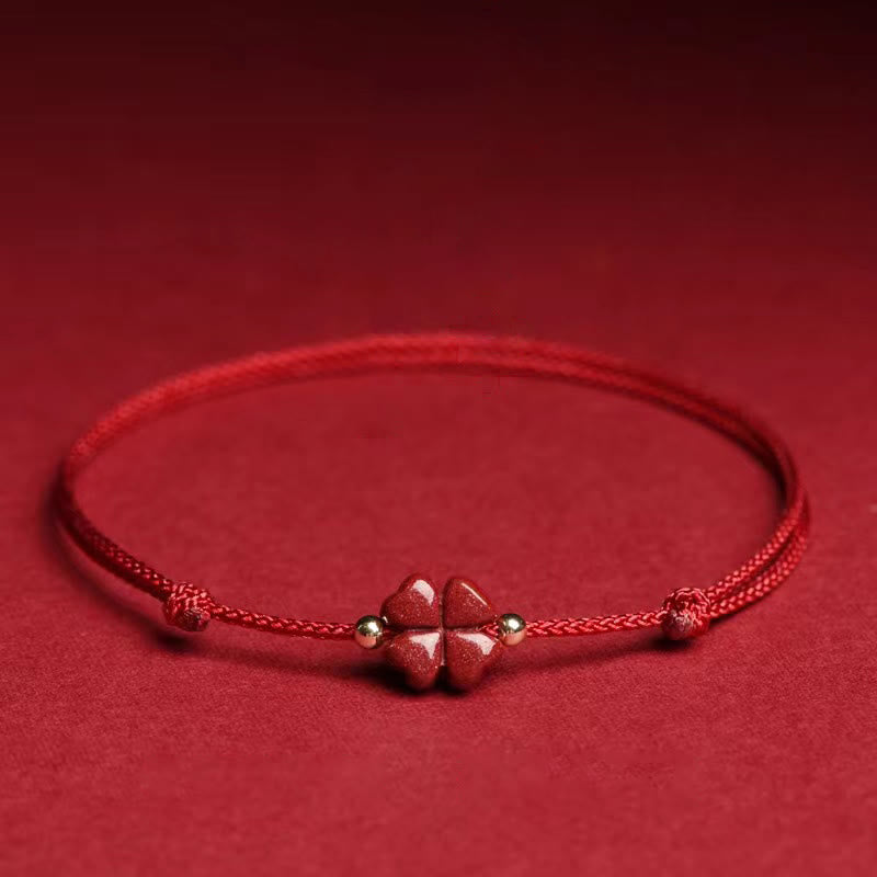 Bracelet de cheville en corde rouge avec trèfle à quatre feuilles en cinabre naturel et Buddha Stones