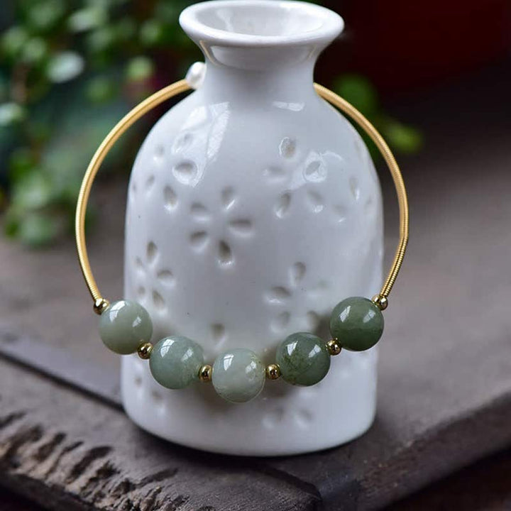 Bracelet jonc en jade avec Buddha Stones et bénédictions pour la chance et l'abondance