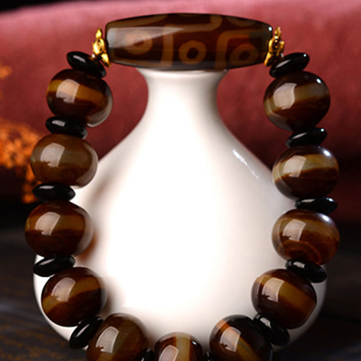 Bracelet tibétain en agate naturelle à neuf yeux avec perles dzi et Buddha Stones