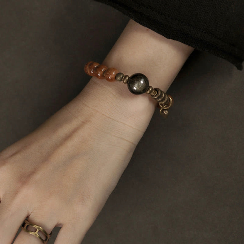 Bracelet porte-bonheur en cuivre et obsidienne dorée avec Buddha Stones de Kuka et œil de tigre