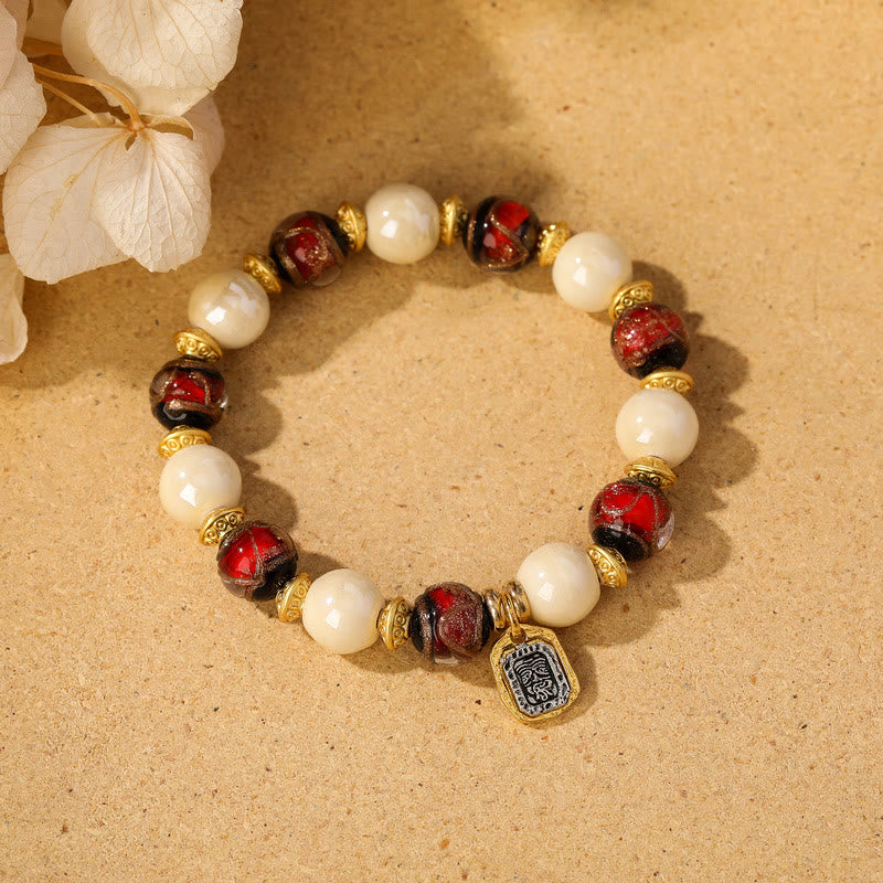 Bracelet de protection en perles de porcelaine en cendres et en verre Liuli avec breloque en Buddha Stones et déesse de la richesse tibétaine Zakiram